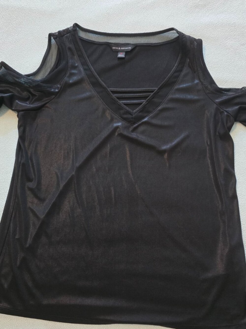 Lady's open shoulder black dressy top